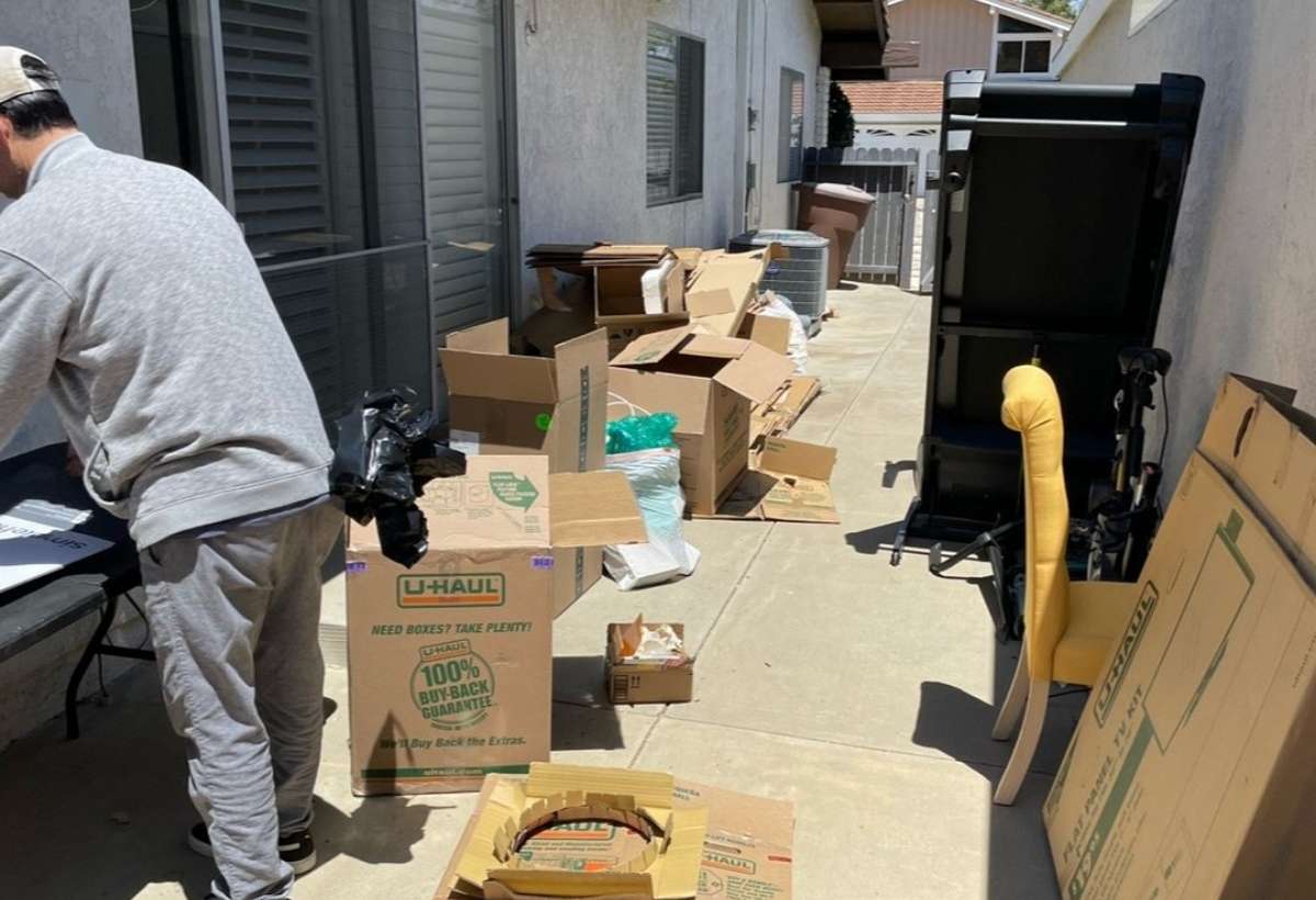 junk smiths team removing some cardboards